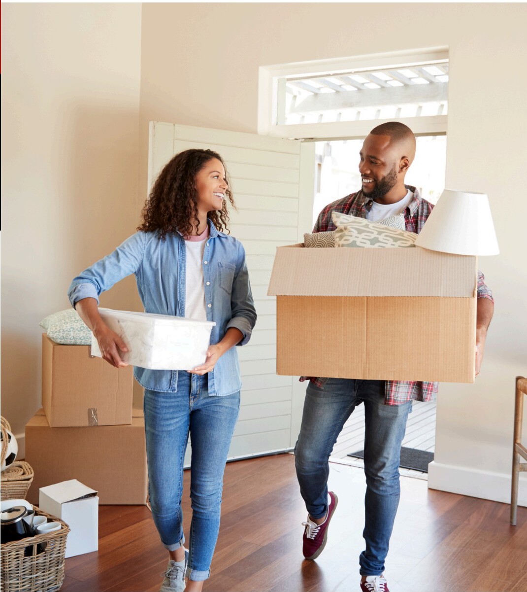 Happy couple moving into their new home
